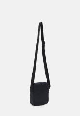 Tommy Hilfiger SKYLINE MINI REPORTER UNISEX Across body bag space blue SKYLINE MINI REPORTER UNISEX Сумка через плечо космический синий